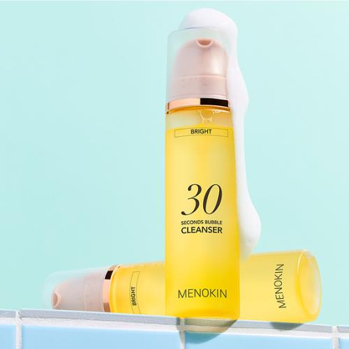 Cleansing balm in 100ml container in pump dispenser on plain white background