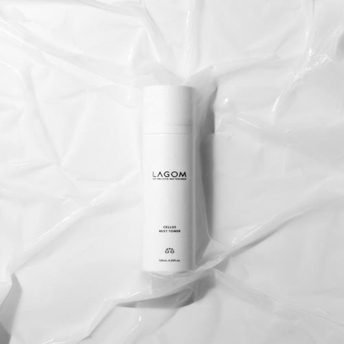 Frosted glass bottle with a silver pump cap featuring PURE Vitamin C Serum 24% 30ml, showcasing a vibrant orange liquid.