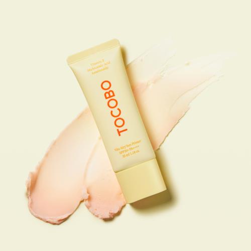 Broad-spectrum sunscreen with skin benefits in 100ml container in squeeze tube on plain white background