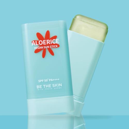 Hydrating lip balm in 09 Salmon Syrup in 30g container with applicator wand on plain white background