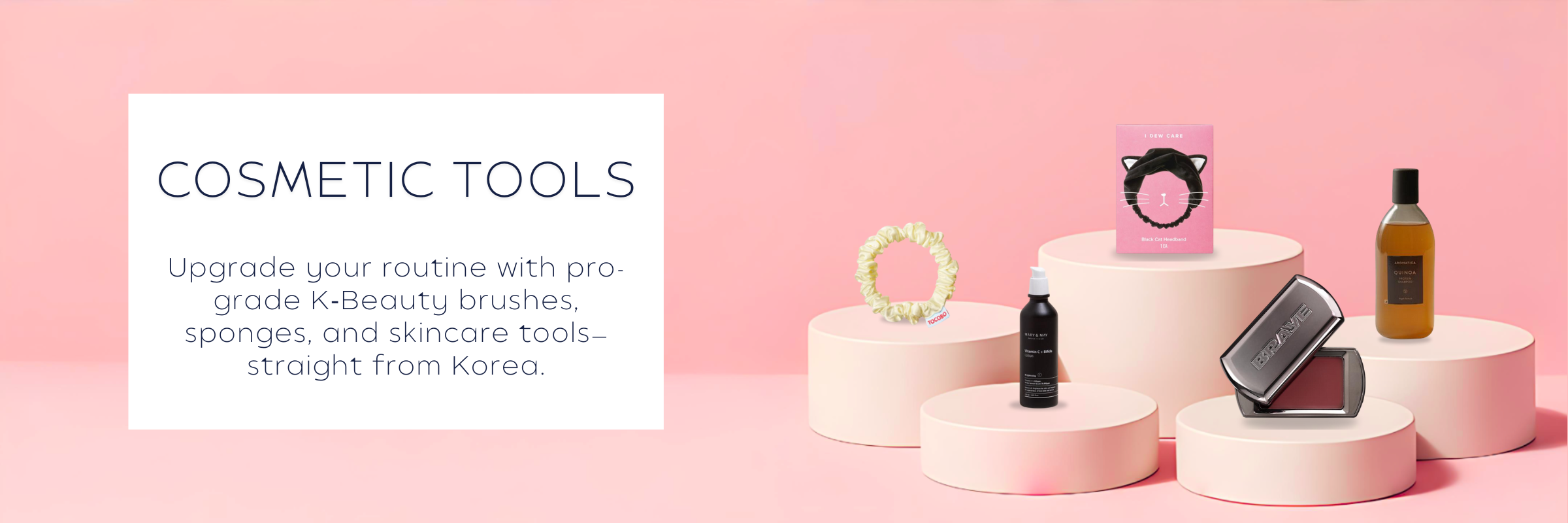 K‑Beauty cosmetic tools collection featuring makeup brushes, sponges, and skincare tools on a soft pink backdrop