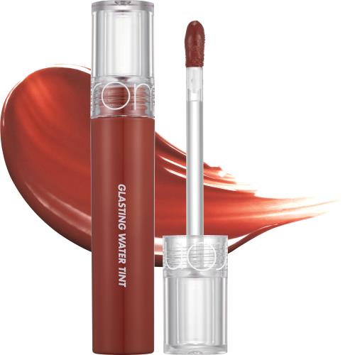 Long-lasting lip tint in 23 Nucadamia in 5g container with applicator wand on plain white background
