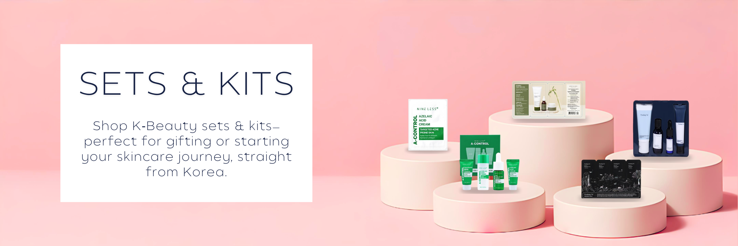 K‑Beauty skincare sets and kits on pink display stands with minimalist background