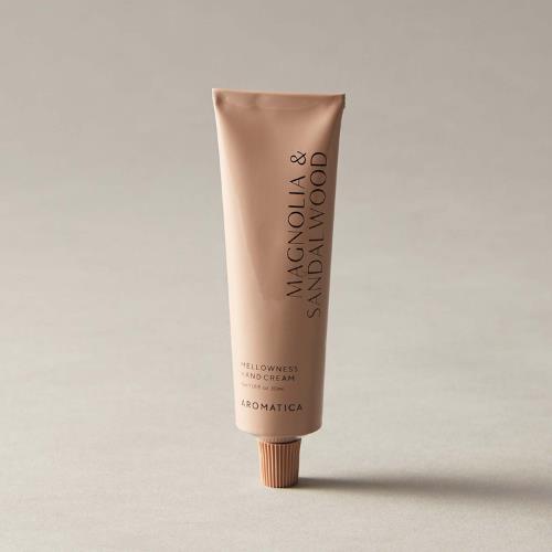 Concentrated sunscreen in 30ml container in squeeze tube on plain white background