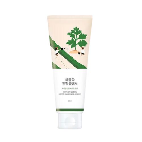 Gentle calming facial cleanser in 2ml container in pump dispenser on plain white background