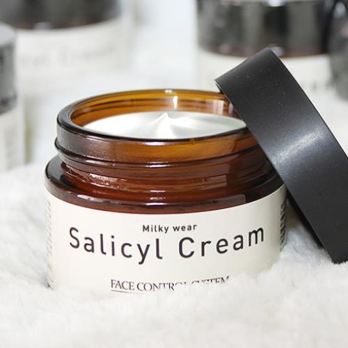 Frosted glass bottle with a silver pump, featuring Pore Remedy Smoothing Primer 30ml label in elegant typography.