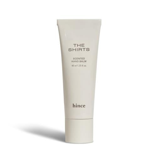 Hair oil in 110ml container with dropper applicator on plain white background